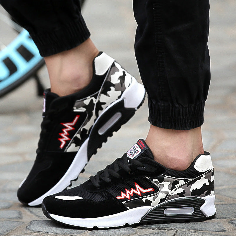 Black and camouflage athletic sneaker with red zigzag design, white sole, and visible air cushioning unit.