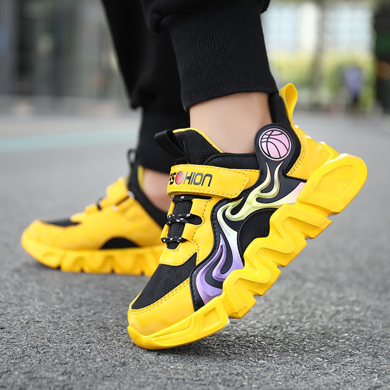Vibrant yellow and black kids' sneaker with flame design, velcro strap, basketball logo, and chunky sole.