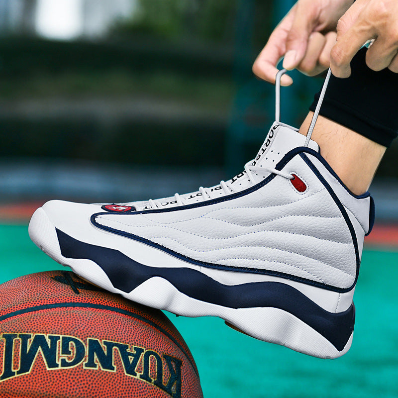 White and navy mid-top basketball shoe with distinctive sole, shown with a basketball.